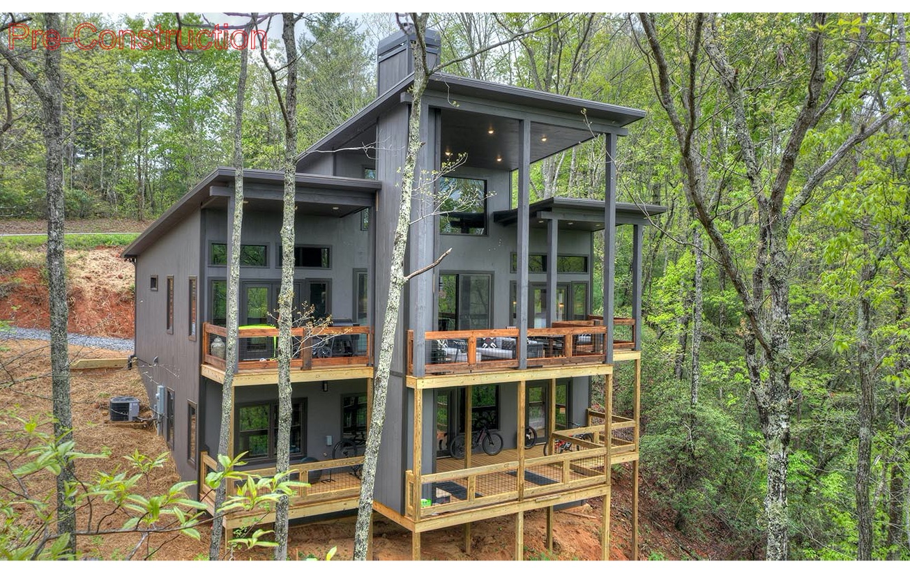 **Pre-Construction Fabulous Mountain Modern** & 4bd/3ba on 18+ acres less than 5 minutes to downtown BR. Simple streamlined look allows you to enjoy all the natural elements that surround the cabin with views of the Cohuttas. Sit on your front porch and listen to the small waterfall that trickles down side of the mountain. Cabin will have a rustic modern design showcasing walls of glass, huge party deck, outdoor fireplace, tile showers, granite countertops, lofty cathedral ceilings, wrought iron railings, massive wood beams, open concept. This COMPLETED-1bd/1ba furnished Cottage is ready to rent out as an STR or stay while the main house is being completed. Build time is 7-9 months. Building site, driveway is being cleared now, septic approved. *plans being finalized- photo is representative of finish but larger. Builder specs upon request. Cash or Contruction to Perm Loan.