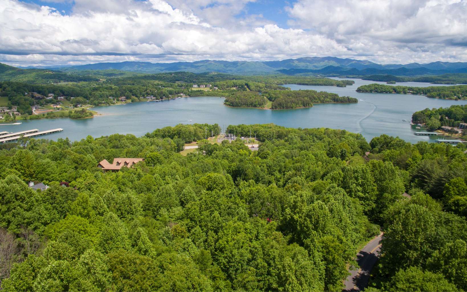 BIG LAKE & MOUNTAIN VIEWS WITH SOME CLEARING!! Located in the premier mountain and lake view community of Lake Forest Estates, with upscale and well kept homes, very close to town, this lot offers paved road access and under ground utilities. PERFECT PLACE TO BUILD YOUR NORTH GEORGIA MOUNTAIN GETAWAY!!