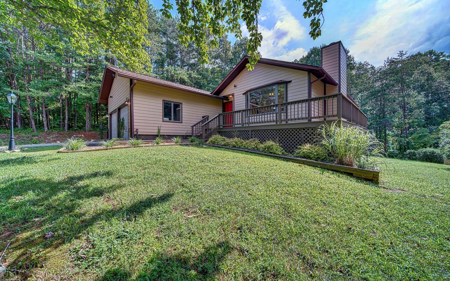 Sweet!!! Remodeled perfect size 3BR home in one of areas most established neighborhoods. This Pinecrest home is only 1 mile from Brasstown Valley Resort, 3 minutes to Young Harris College & Lake Chatuge & less than 10 minutes to Hiawassee. The home has been lovingly upgraded with new floors, kitchen, stainless appliances, granite countertops throughout & light and plumbing fixtures. The lot is a hard to find gentle 0.65 acres. The main level includes the Master suite with a bath that features tile floors, shower & double vanity as well as a guest BR & BA. The Great room has a real FP, cathedral ceilings & is open to the Kitchen & Island with a sink and bar. Most of the Terrace level has been finished & has a wet bar in a bonus room as well as a huge 3rd BR with bath. There is storage on this level. Other features include a 2 car garage, wrap around deck, covered back porch & outbuilding.