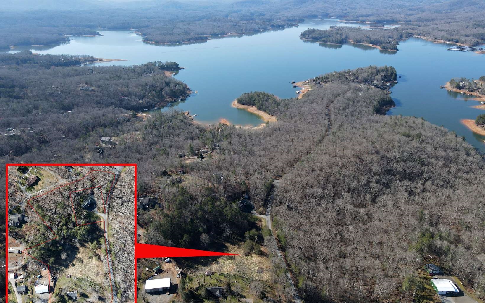 Great location, Minutes to Blue Ridge. This property is within walking distance to USFS lake access and also borders USFS on one side. Quiet established community with a few acres left to sell. Views of Lake BR can be seen from the property without Lake Blue Ridge prices. City water is available and all paved access to the property makes this a great investment. Also located between Morganton Point and Lakewood Landing. The survey is in the process to remove the home from sale.