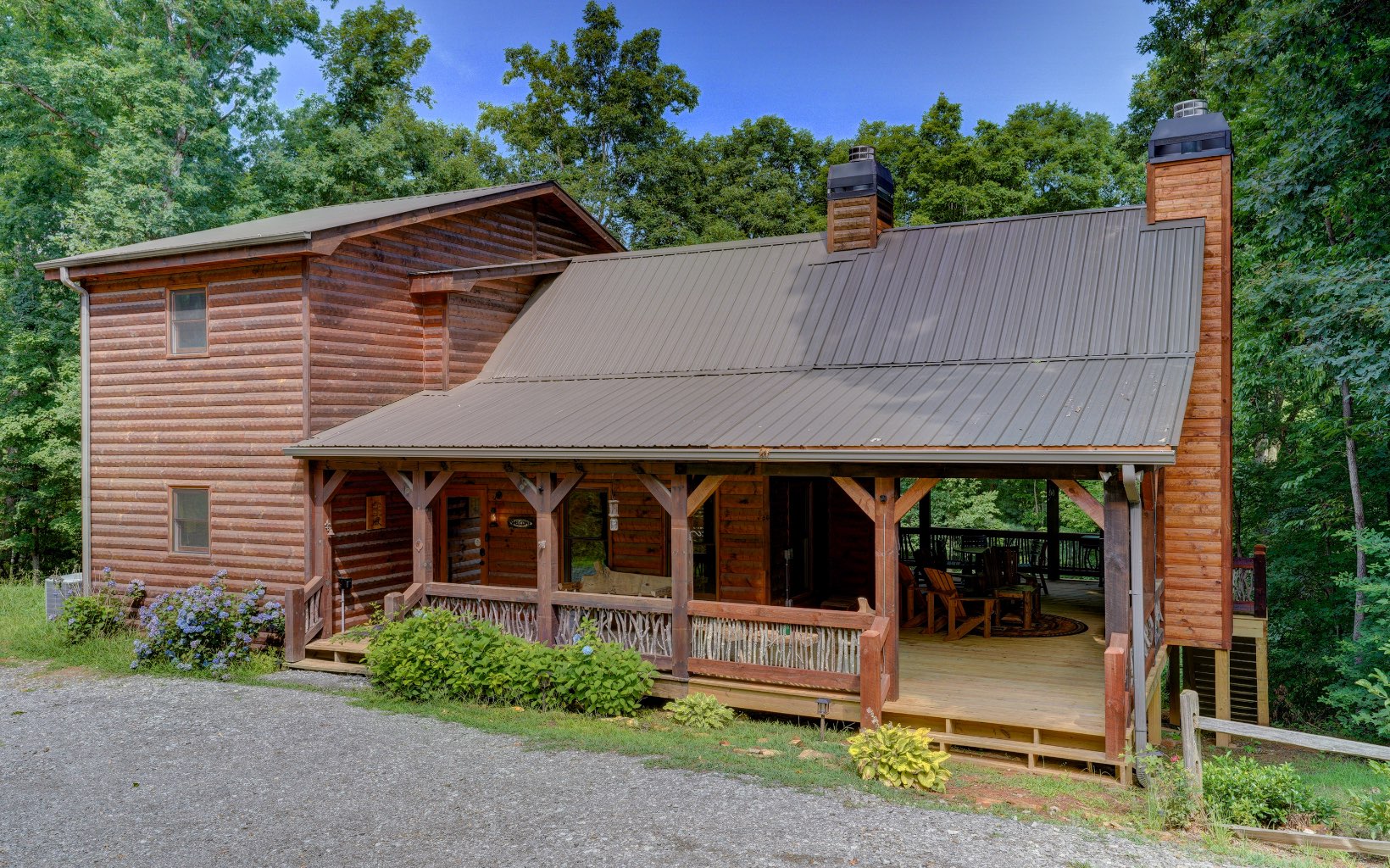 Cozy 3/3 cabin located just outside of downtown Blue Ridge w/ deeded Toccoa River access! Entering the home you will be welcomed by a soaring vaulted ceiling and beautiful floor to ceiling rock fireplace. To your left you will have the beautiful kitchen w/ granite counter tops and dining room table. Additionally on the main floor is a bedroom and full bath. Upstairs will bring you to the loft and master bedroom. The loft is used for additional beds but would make for a great office space! The master bath has a huge walking in shower and Jack & Jill style vanity w/ granite to match the kitchen countertops. The basement offers an additional bedroom, full bath, laundry room, storage room, and game room. Walk outside to an amazing porch w/ wood burning fireplace and a short walk to the community area down by the Toccoa River! This home would make for a great vacation rental or second home!