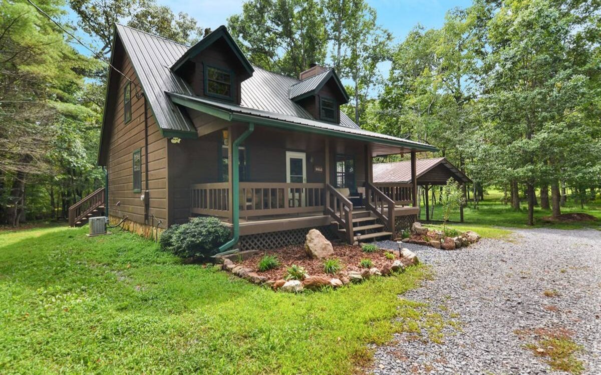 You do not want to miss the opportunity to check out this professionally furnished retreat in the woods. This cozy cabin is ready to continue as a short-term rental or become a full-time residence. This 3/2 is located in Morganton on a level lot with a 2-car carport and circular driveway with lots of room for parking. There are many areas of entertaining including a fire pit, hot tub, air hockey, darts, ping-pong, outdoor picnic table, and horseshoes! The basement is roughly finished and ready for your ideas to come to life. Did I mention this cabin is coming FULLY furnished by a professional? With an open floor plan on the main level and 2 bedrooms on the 2nd floor, you or your guests will feel right at home. It is turn-key and ready to go. Call or text today to book your appointment!
