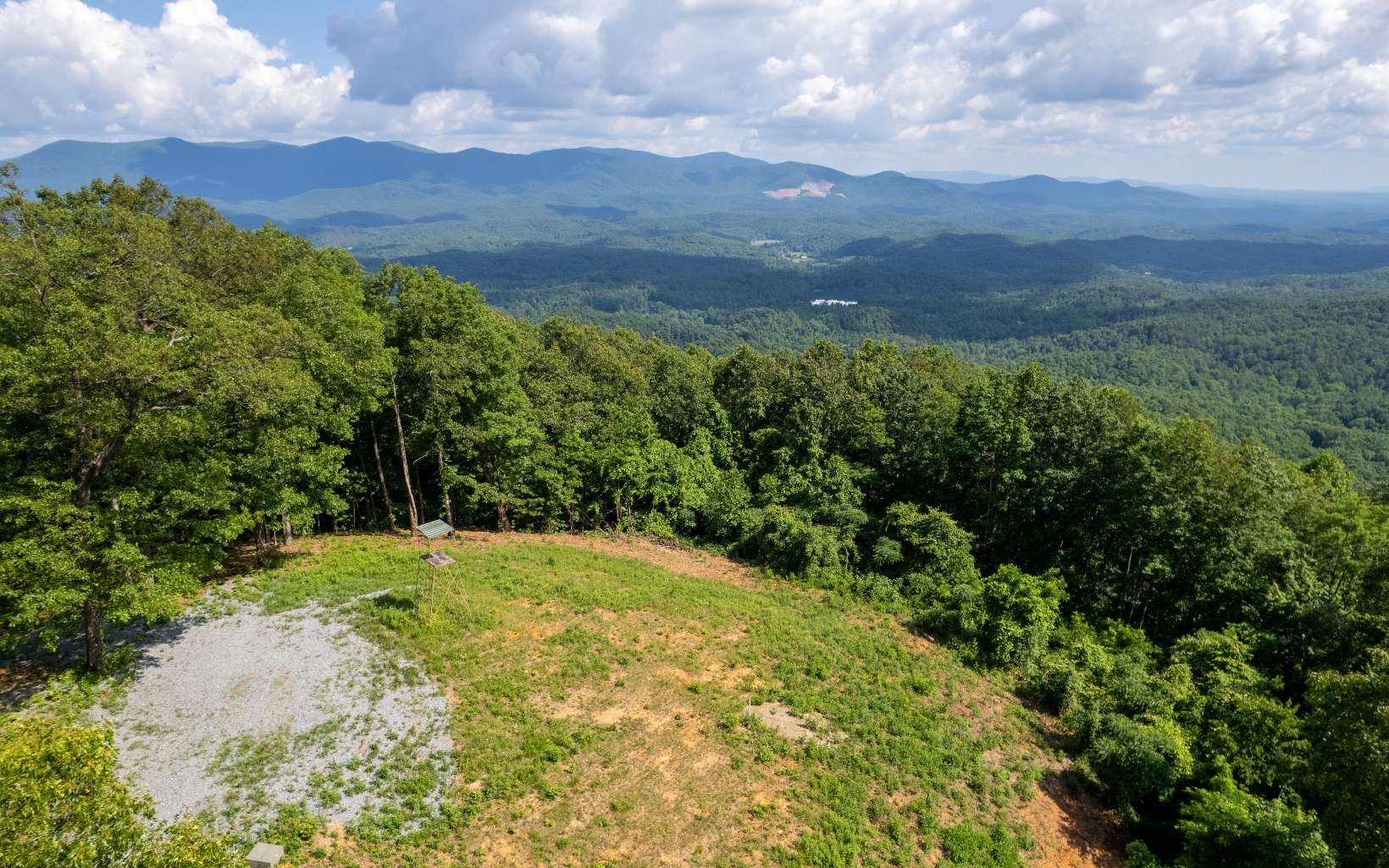 This unique 2550 ft elevation lot has 1.49 acres that encompasses the entire top of Double Knob Mountain in the exclusive ““Eagles View “ Subdivision. This lot is already partially cleared for incredible views of the Cohutta Wilderness to the North and the Rich Mountain Wilderness to the South. Underground power, telephone already in place, and a has a new 10 gpm well with excellent tasting Spring water. Lots 5 and 6 are also available for additional privacy.