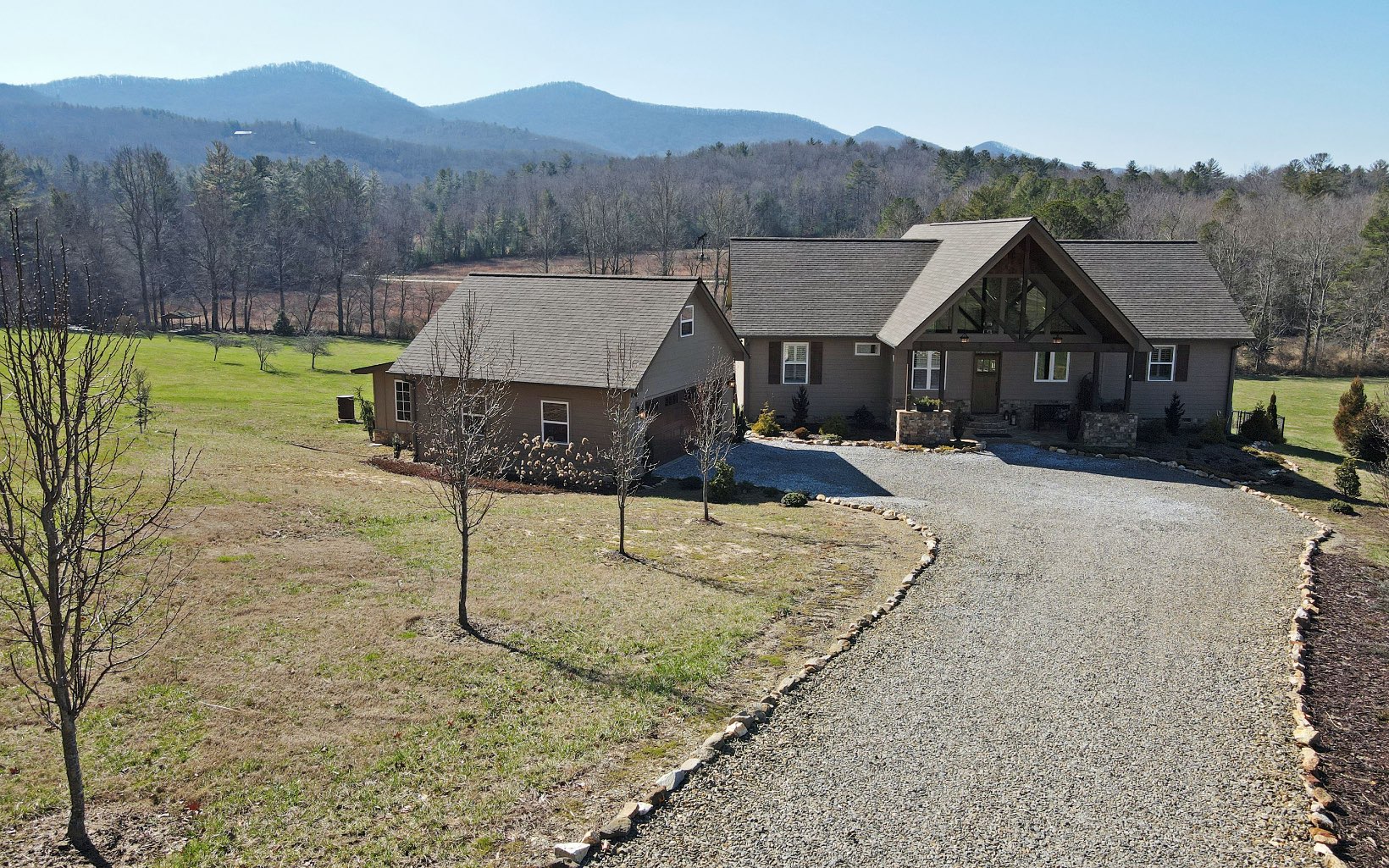 Hello Country Living! Stunning Mountain Views, Pasture & Creek Front! Mini-Farm Potential! 4 Acres on Little Young Cane Creek! 2019 Build, One Owner, One Level Ranch Living: 3 Bedrooms, 2 Baths. Open Living: Gorgeous Kitchen with Leathered Granite, Custom Cabinetry & SS Appliances! Dining Area. Dual-Sided Stone & Gas Log Fireplace. Fabulous Great-Room with Hardwood Floors Throughout, Vaulted Ceilings & Sweeping VIEWS. Wood Ceilings in Bedrooms + Tiled Showers. Enjoy All 4-Seasons on the Covered Back-Deck w/ the Unbelievable Mtn Views & ALL without the Steep & Winding Roads! HardiBoard Siding, 2 Car Detached Garage w/ Storage Bonus Room Above + Gardening She-Shed! Fenced Backyard for your Fur Babies or Kiddos! Sensible Restrictions to Protect your Investment! FINALLY: Plenty of Room to Park an RV, you just need to Enclose it! Nice Privacy Buffer.