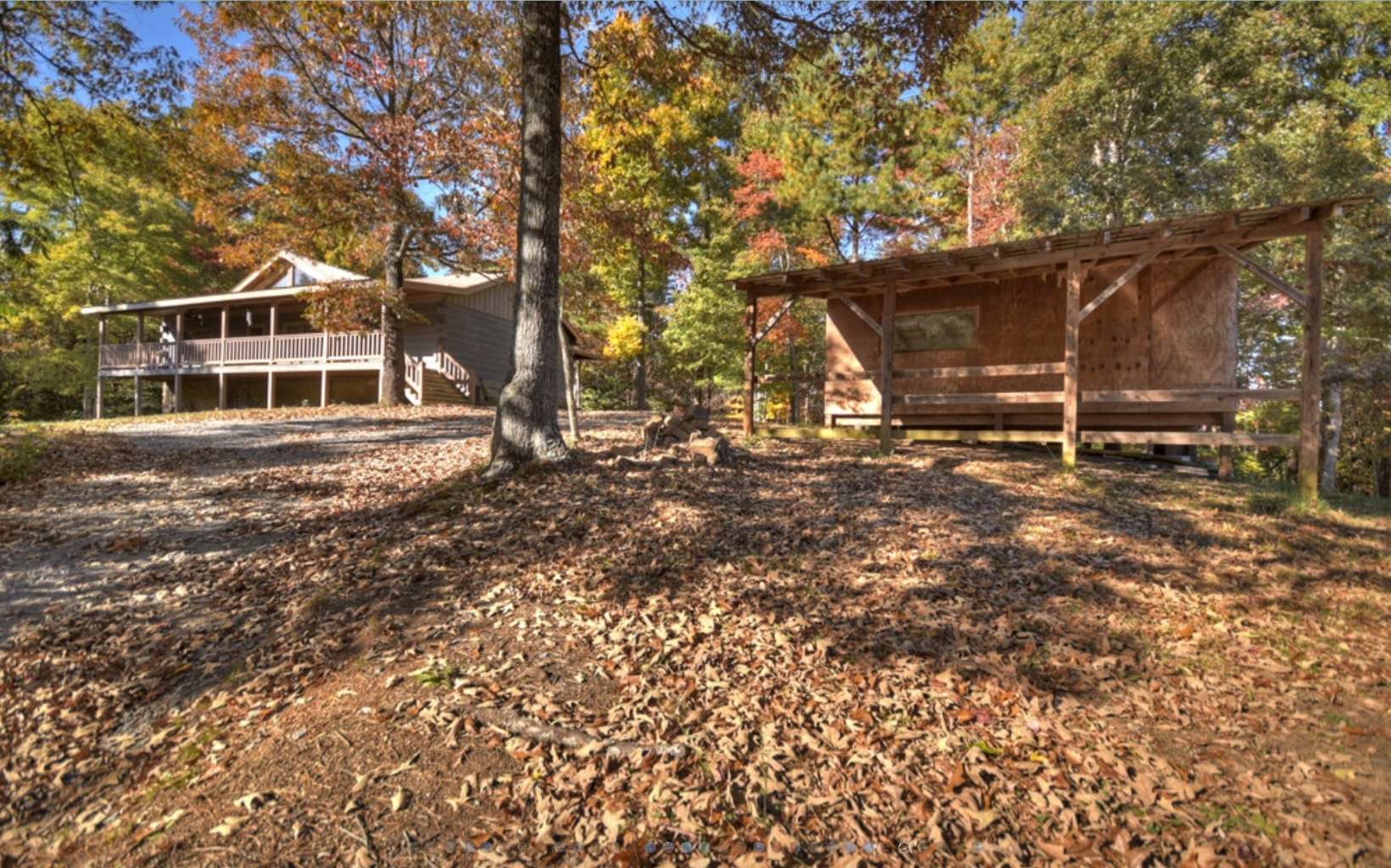 This beautiful true log cabin is nestled on a very private and wooded 1.01 acres just a short 10 minute drive from Historic Downtown Blue Ridge. Featuring an open floor plan that flows through the kitchen, dining area and into the livingroom complete with its own wood burning stove, stunning high vaulted ceilings with exposed wood beams, Bamboo flooring throughout the home, 3 bedrooms and 2 bathrooms with custom tiled showers, this spacious Cabin would make a wonderful home for a growing family or the perfect short term rental property! The property also includes a workshop complete with electricity!