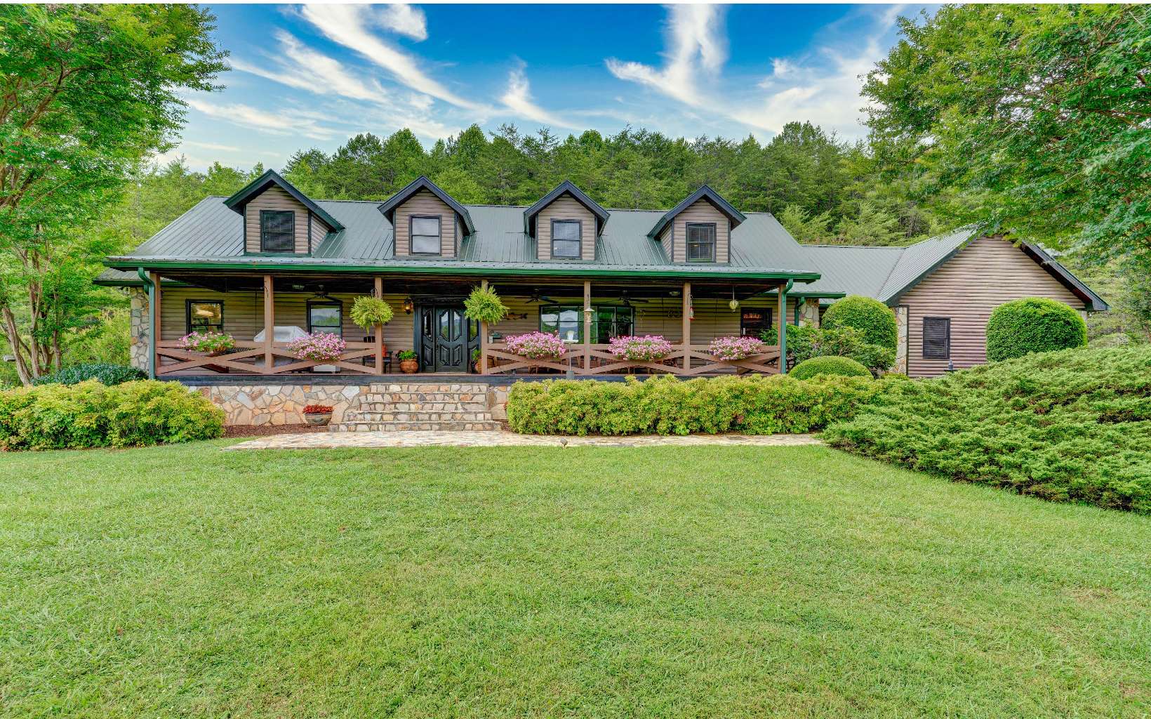 Gorgeous Mountain Retreat nestled in the North Georgia Mountains on 15 acres. Surrounded with breathtaking Mountain Views, barn, stocked pond, common area with River Access. Rocking chair front porch, 4 BR, 4 Full BA , 2 half Baths. Spacious floor plan, Kitchen features large Island with leathered granite counter top, walk in pantry, laundry room on main level. Family room with stone fireplace, Master on main level with pink marble fireplace, walk in closet. Garage with attached breezeway to main house, Guest suite, full finished basement with workshop. Must see this one. So convenient to Blue Ridge GA and Ellijay, GA.