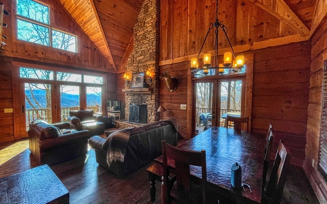 Spectacular log home built by Modern Rustic Homes with lots of wood and stone, outdoor living spaces, outdoor fireplace, 4 standard bedrooms plus a bunk room that sleeps 6 for a total of 14 beds (all included). Very Private Setting with Breathtaking year round mountain views. Home featured in Log Home Living Magazine. Short Term Rental. See Agent for Details.
