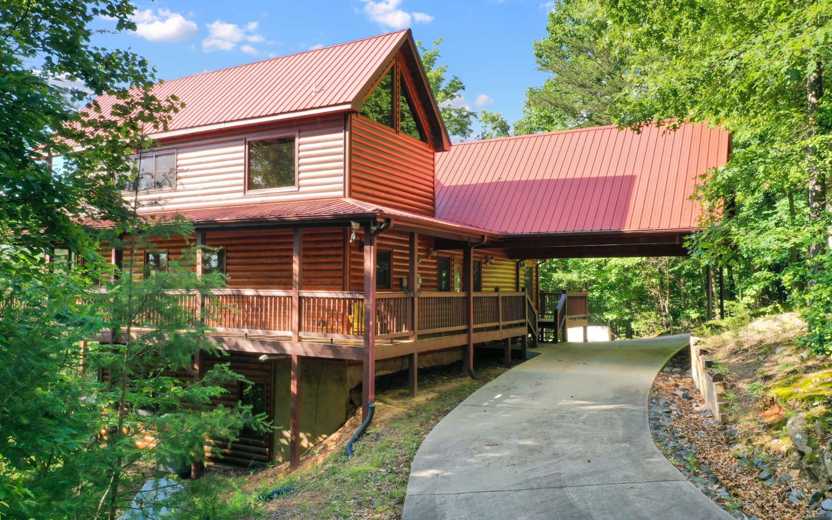 Bring All the Family or your Favorite Friends to this Gorgeous Cabin in the North Ga. Mountains situated on one of the highest peaks around (Piney Mtn.). 3 BR/ 3 BA Log Sided Cabin with a Long-Range Mountain View (Improved with a small amount of tree topping). All paved access & less than 15 minutes to downtown Blue Ridge, Blue Ridge Lake or the Toccoa River. Huge screen porch on the view side, wrap around porches, metal roof. Master offers a private porch, fireplace, spacious master bath, jetted tub & tile shower & double vanities. Actually, you could have 2 masters no problem. The lower-level game room & the living area on the main floor are very accommodating for several people to gather. Prepare your meals while enjoying the mountain view, then sit at the separate dining area, same great view. On demand hot water, Plenty of parking here, circle drive with log carport + detached garage.