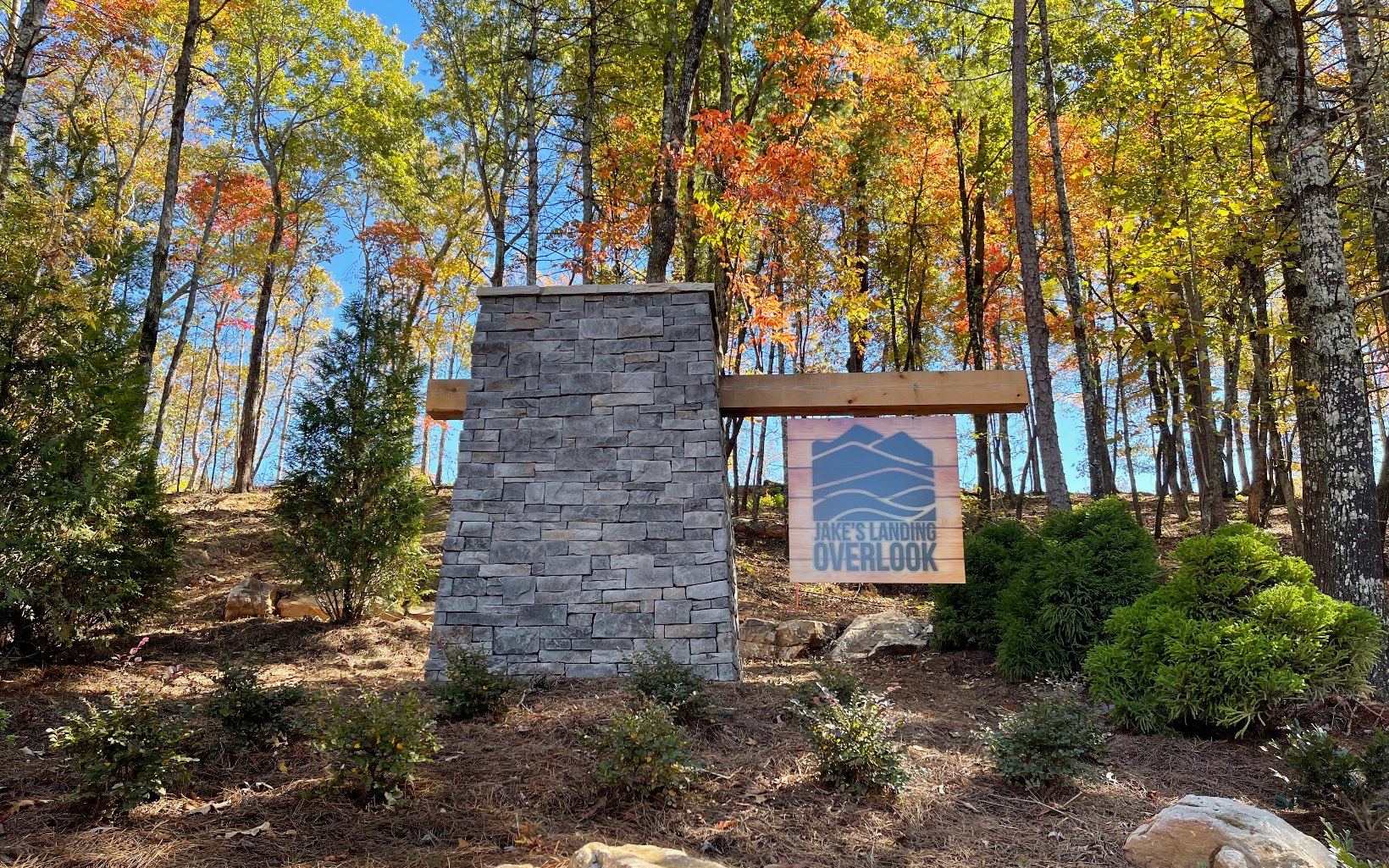 Welcome to Jake's Landing Overlook, a breathtaking new development just next to Carter's Lake's Ridgeway Recreation area with a boat ramp, dock, picnic tables, hiking trails etc. 20 minutes from scenic Ellijay, GA. Enjoy the long range views throughout the gated community. Lot 77 has gentle level area and a small spring fed creek at the back left corner of property and a community well on back right corner. Vacation rentals allowed! Community has unique access to Jake's Landing waterfalls and trout stream. Community in-ground pool coming soon, pavilion, fire pit, trails. Make this your full time or vacation home. One of few subdivisions which allow owners to build small homes from 500-1200 square feet! Rare opportunity for tiny home people! Build your income-producing getaway now! FORBES:Ellijay, #9 highest vacay income-prod. USA town! High speed internet, underground utilities. Lot 79 available.