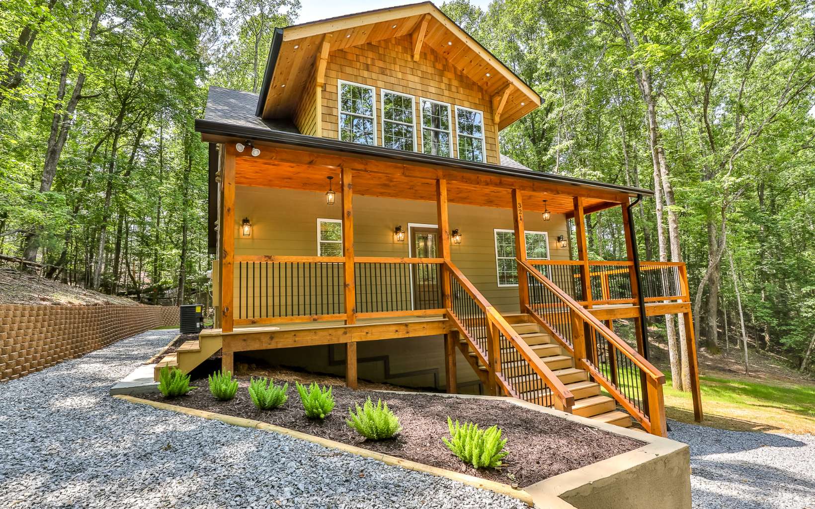 Experience the pinnacle of mountain living in Ellijay, Georgia! This stunning Modern Rustic style home sits on a private 3/4 acre wooded lot, offering serenity and privacy. With 3 bedrooms and 2 1/2 baths, this spacious retreat boasts a main-level master, open family room, and an inviting eat-in kitchen. Enjoy large porches, an outdoor fireplace, and room for a dog run, firepit, and garden. The walk-in crawlspace provides expansion potential. Upstairs, find a loft, two bedrooms with a shared bath, and a soaking tub. Embrace community amenities like rivers, swimming pools, parks, tennis, pickle ball and more. Short-term rentals permitted. Don't miss this mountain paradise! See for Yourself!