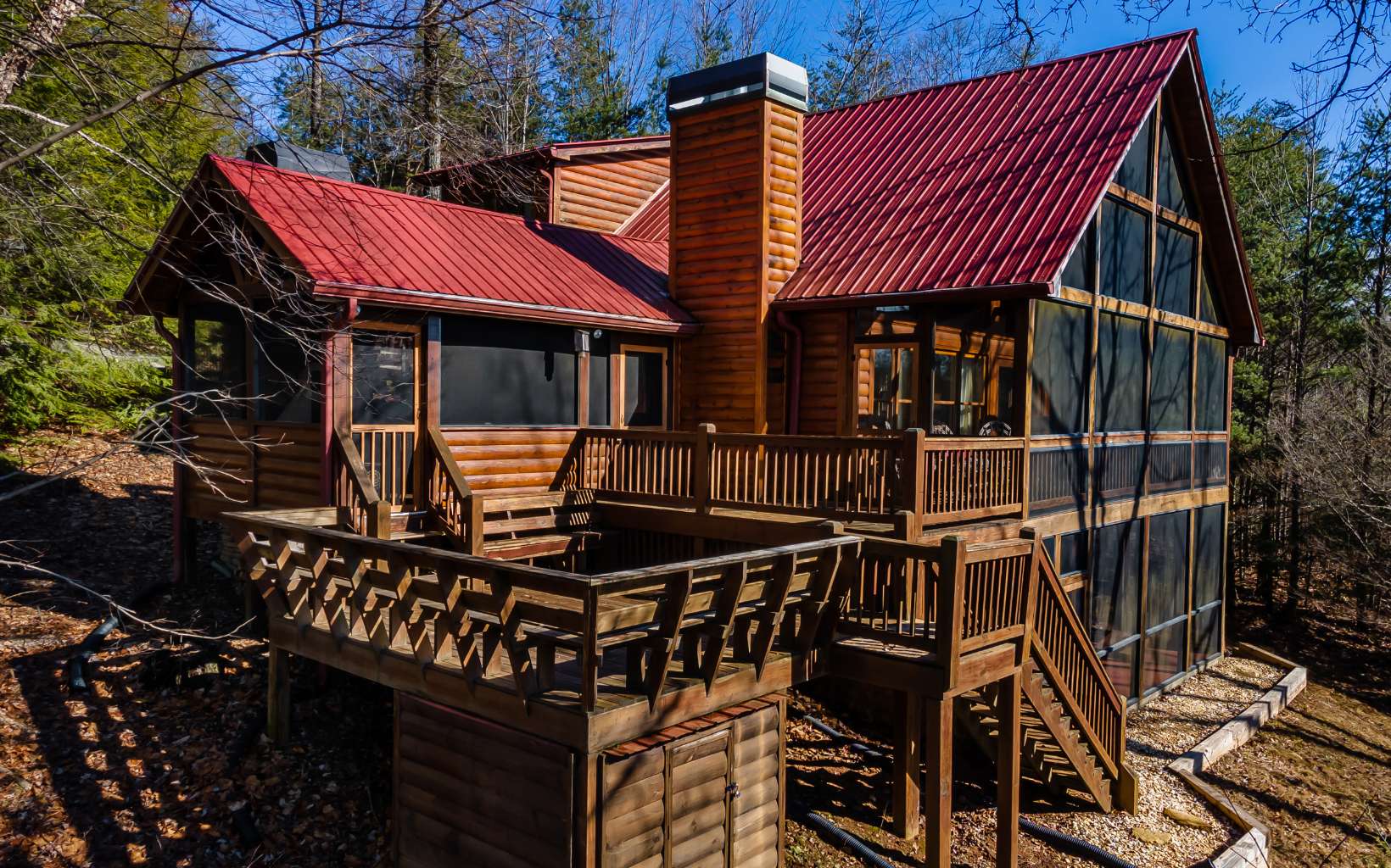 High Elevation Mountain Adventure Outpost! 300 ft. from 36,000 acres of Cohutta National Forest to hike the Benton MacKaye from your door. This is the end of the line, an enclave of only 3 cabins on top of this ridge but only 25 min to Blue Ridge and Ellijay. 3BR/3BA w/ open living/dining/kitchen centered on the HUGE WALL OF GLASS & EXCEPTIONAL LONG RANGE MOUNTAIN VIEWS. Full finished terrace level w/ BR/BA & game room. Built for the outdoors, full-length view side screened porch, Outdoor screened-in living room w/ natural slate floor, beams & a stacked stone wood burning fireplace. No drive-by traffic (no dust), 3+AC of land, and end-of-the-road privacy. Some furniture is negotiable. New HVAC and 12000 KW Generator. Previous buyers financing fell though and terminated contract.