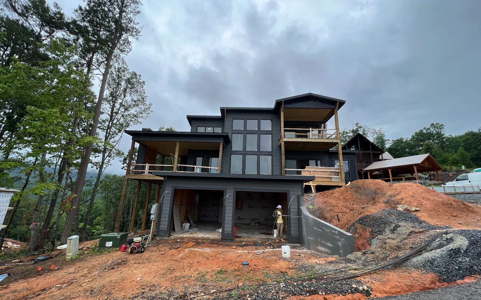 UNDER CONSTRUCTION! Mountain modern meets contemporary luxury in this chalet above the clouds. A custom design by architect Tony Boyatt, This Mountain Modern home features gabled roofs mixed with mono-slope roof lines. The mono-slope roof lines lift to optimize the views of the surrounding mountains & Lake Blue Ridge, bringing the natural light inside. The interior blends materials from both rustic and modern pallets for the perfect combination. While the reclaimed lumber gives the home a rustic sense, the white quartz oversized island & expansive glass windows offer a modern twist. Upon completion you will find upgraded appliances & a custom interior design by BH Interiors, leaving no detail out. Come add your personalized final touches:)