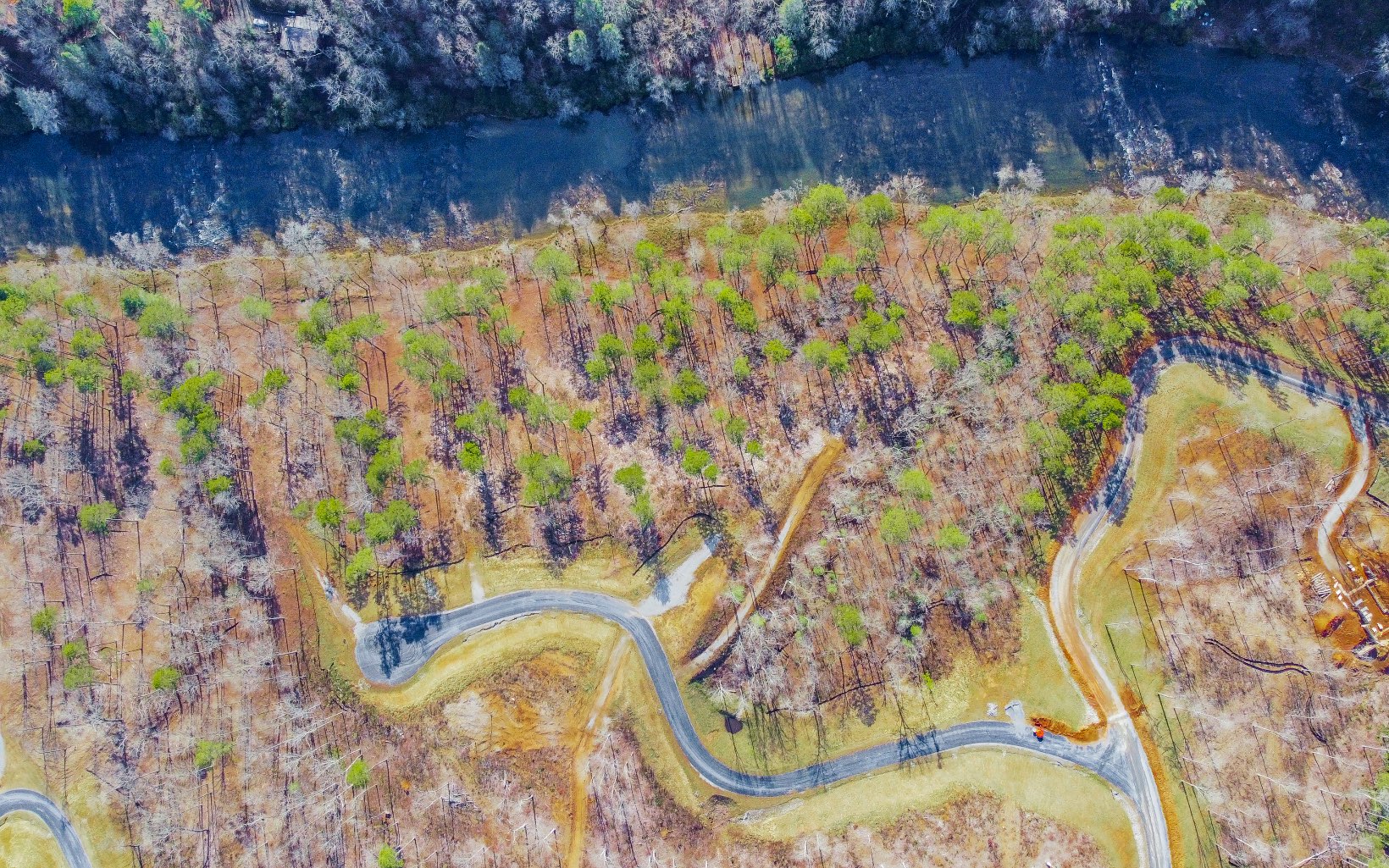RIVER FRONT LOT - This 3.36 Acre Lot sits along the Beautiful Coosawattee River located in one of Ellijay's Newest Gated Communities, High River. Features include Homesite Cleared along with the Driveway in place so just bring your Builder or a List of Local Builders can be provided, Paved Road Frontage, Level Area At The River and Breath Taking View of the Coosawattee River.