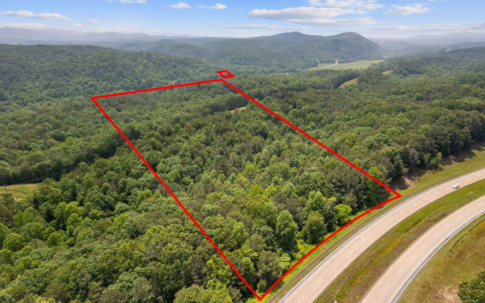 LOOKING for an exceptional estate sale opportunity in Talking Rock, Georgia?! This stunning property offers a generous 18.22 acres of land, presenting a unique chance to own a piece of this beautiful small town. Boasting frontage along Hwy 515, this parcel provides excellent visibility and convenient access.Nestled within the picturesque countryside, this tract of land offers breathtaking views of the surrounding mountains and a scenic creek, adding to its natural allure. The rolling and steep topography adds character and charm to the landscape, making it a truly captivating location. As an added benefit, an adjoining 18.14-acre parcel is also available for sale, presenting an incredible opportunity to expand your ownership to a potential 36+ acres. This opens up endless possibilities for development, investment, or personal use. Come take a look today!