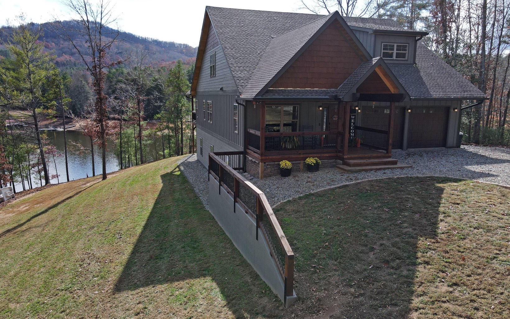 Beautifully upgraded LAKE HOME in Blairsville sits right on Lake Nottely with year-round deep water. Ample lake frontage on .87 acre lot. 3 bedrooms, 2.5 baths, designated home office w/ fiber optic, two car garage, laundry room, bonus room, and full basement. Great room with abundant windows offers gorgeous lake views, stone fireplace with ventless gas logs, cathedral ceiling, engineered wood floors, and spacious dining area. Kitchen has a sizable pantry, center island, stainless steel appliances, & elegant leathered granite. Nine ft. ceilings. Let your imagination explore the possibilities when finishing out terrace level, which is stubbed for bath. Conveniently located to Blairsville. Dual heat with four climate controlled zones. Some outlets and appliances are Smart enabled. Foam insulation. Exquisite quality throughout this summer or permanent home.