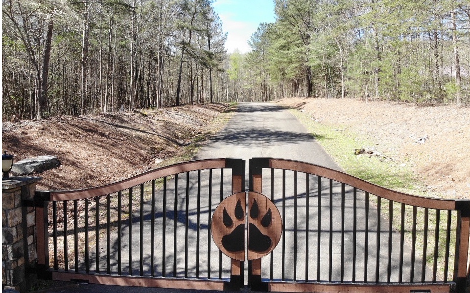 This beautiful level lot is located in the quiet and gated community of Bear Paw. Neighborhood has paved roads. Power is available at the street and the lot has been approved for septic and a well.
