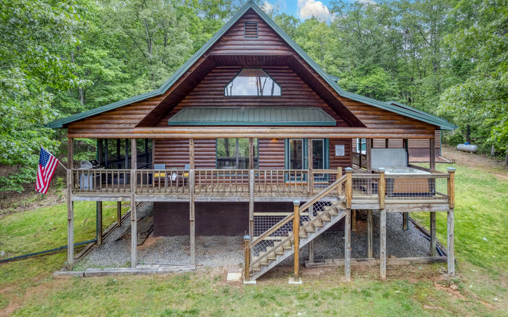 This cabin is as cozy as gets and comes with an impeccable view, 3 large private bedrooms, 2 full baths with beautiful showers and a soaking tub!! 2 bedrooms have brand new 42" smart TVs already mounted. Enjoy entertaining in one of the many luxurious spaces this home has to offer. Get the vacation started on the deck while relaxing in the bed swing or hot tub overlooking the views! Relax with a refreshing beverage from the fridge in the huge chef's kitchen with tons of storage, beautiful granite, and subway tile. Enjoy a hot beverage while staying warm by the fire-pit! New paint throughout the home as well as an added on cell phone service booster and a Generac generator that can power the whole house. Park in your oversized, detached workshop/garage or on the HUGE circular driveway. Haven at Thomas Mountain is privately tucked away only 15 min from downtown Blue Ridge, Lake Blue Ridge Marina and Aska Adventure Area. This is the perfect retreat for full time living or a successful short term rental investment opportunity! Furnishings are negotiable on a separate bill of sale.