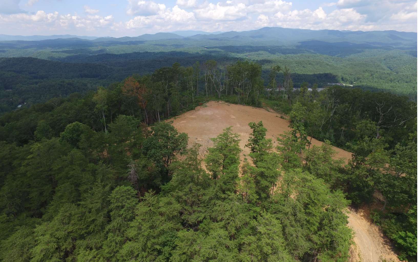 360 Degree Mountain Views from Mountain top! Long Range Mountain VIEWS! Road System roughed in with home sites in place Easy access from Highway 515 for Tax ID Parcel # 3094-009 consisting of 135 +/- Acres. Tax ID # 3094A-007 consisting of 6.9 +/- Acres & 3094A-008 consisting of 5.3 +/- Acres from Cherry Log - Stonecrest Subdivision; Located between Ellijay and Blue Ridge!