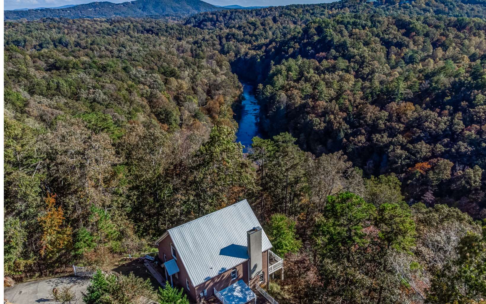 Amazing Long Range Mountain and River View! Rare find in this area! You can even hear sounds of the river when sitting on your deck or even inside with the door open! Low Maintenance brick home on 1.03 acres. 4 bedrooms and 4 full bathrooms. 3 masters total in this home with spectacular views on every level. Upstairs offers an additional master with a private sitting area. This home would make an amazing short term rental, full time living or second home. Wood burning fireplace. Sound system throughout house. Central vac and Dual Hvac. Whole house generator. Basement is a perfect mother n law suite with a bedroom, bathroom, living room, large deck, wine cellar/storage area, one car garage and mud room. Concrete driveway and located on a paved road. Plenty of storage. Located in the beautiful Coosawattee River Resort with amenities: River access, 3 pools(one indoor), fitness center, mini golf, playgrounds, basketball/tennis courts, gated entrance. Located close to many wineries.