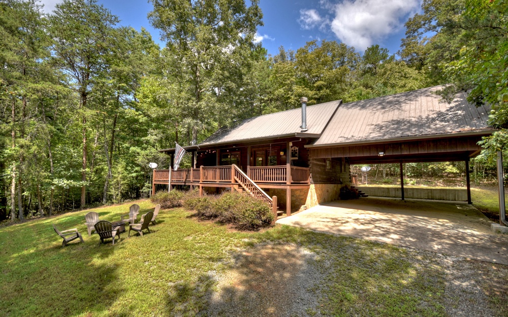 This amazing cabin offers TOCCOA RIVER ACCESS that's great for tubing, fishing or kayaking!, outdoor entertainment space on the spacious decks, hot tub, firepit area, 2 car carport and most of all...PRIVACY! True log cabin, 2br/2ba PLUS sleeping loft, upgraded kitchen appliances, cathedral ceilings, Master Bedroom on the main level, completely furnished & already established on successful rental program w future bookings already in place! Easy access for all vehicles. Centrally located so it's close to golfing at Old Toccoa Farm golf course, whitewater rafting on the Ocoee, dining on the river in McCaysville, shopping in Downtown Blue Ridge or visiting the Casino in Murphy, NC! Over 2 acres of private, useable land! Owners have made sure to provide plenty of activities for all age groups to ensure a great stay at this wonderful cabin!