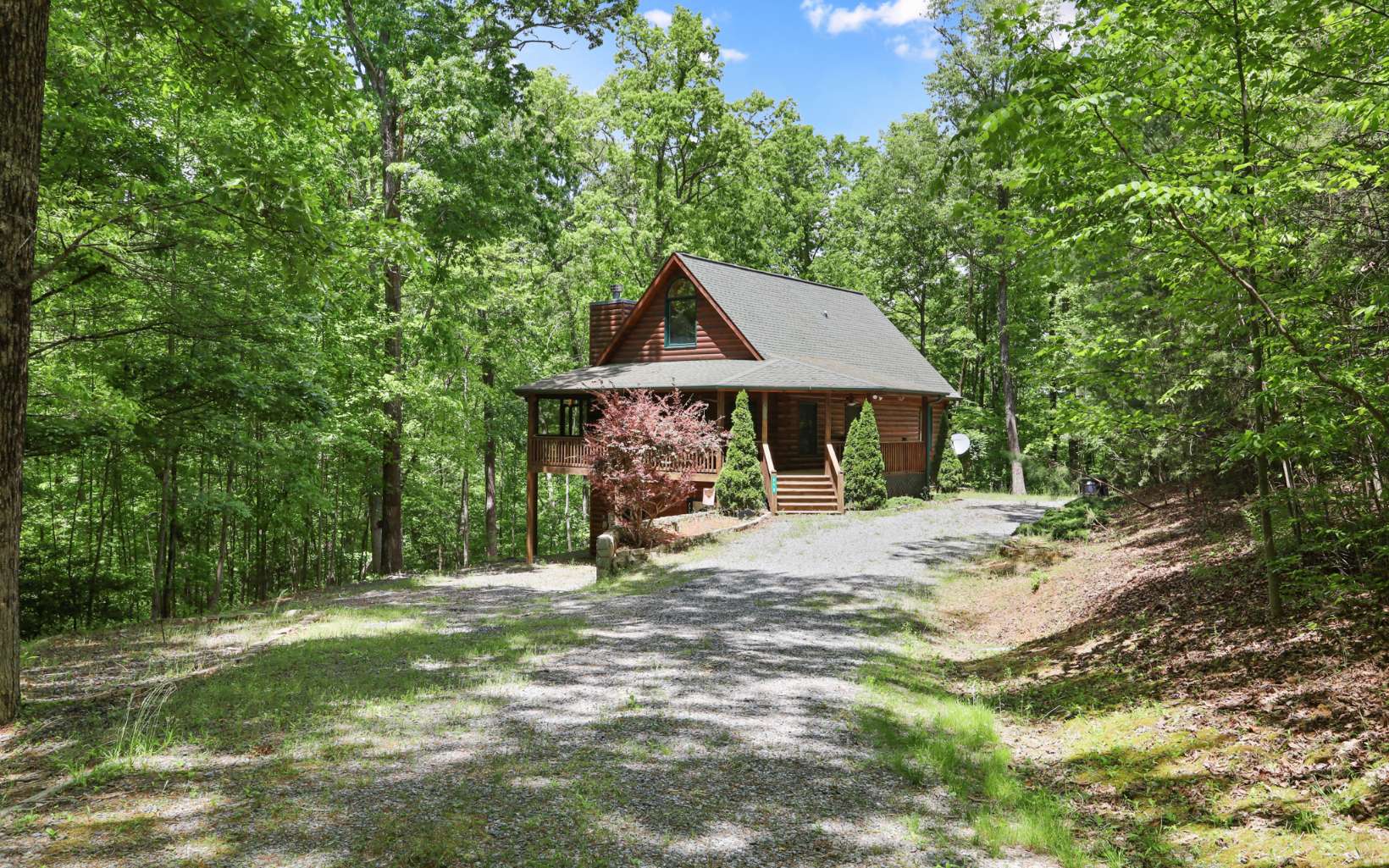 PRICED TO SELL! Here's your opportunity to own a Real Log Cabin sitting on 2.02 ac and FURNISHED! 4 bdrm plus a sleeping Loft, 3 baths, open floor plan w/ great rm, kit and dining rm. Gorgeous dry-stacked rock fireplace, hardwood floors throughout, screened in porch, wrap around deck, laundry on main level, basement garage for parking or storage and wired for back up generator ! Tons of parking space and seasonal Mtn views! Great rental potential or perfect investment for weekend get-a-ways ! Super close to fishing on Fighting town Creek, shopping in downtown McCaysville and Blue Ridge, boating on Blue Ridge Lake, Hiking on Aska Adventure Trails as well as rafting down the Ocoee Whitewater River or Gambling at the Casino in Murphy NC! Perfect location! It wont last long! Give me a call!