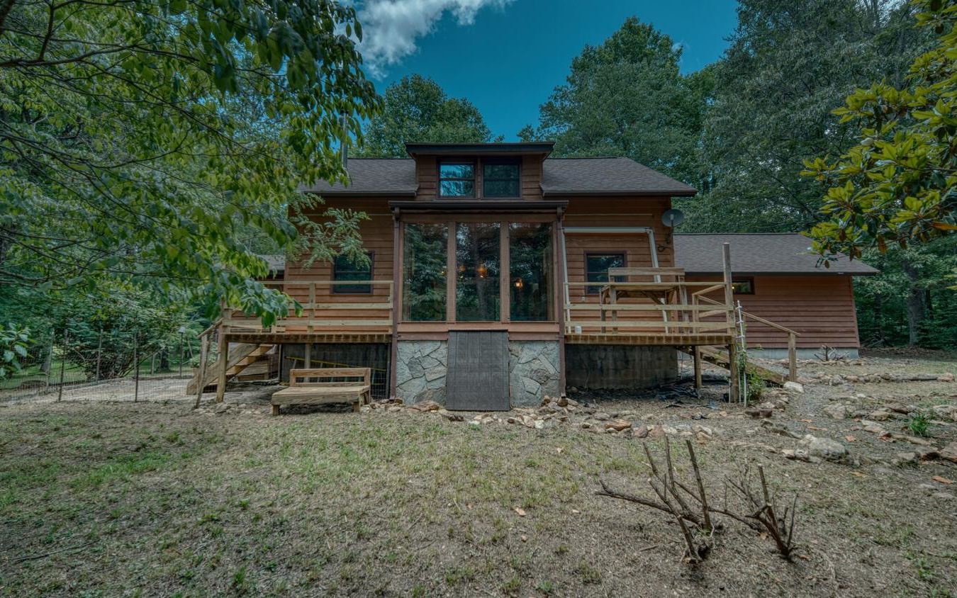 ENDLESS POSSIBILTIES WITH THIS RARE CREEKFRONT GEM!! Welcome to a truly unique & one-of-a-kind Post & Beam built home, located in the serene & picturesque North Georgia Mountains. This stunning home sits on 4 usable acres of land, complete w/ a gently babbling creek, providing a peaceful & serene escape from the hustle & bustle of everyday life. The post & beam construction of the home is a true work of art, with impressive craftsmanship & attention to detail that is sure to impress. Upon entering you will find a foyer entry w/ sprawling stone floors that spread into the kitchen & living areas. Breakfast area has 5 BRAND NEW fixed glass windows. Small BR on the main along w/ half BA & laundry. Upper level features master suite w/ 2 closet, sitting area & sauna! Large workshop attached to home could be converted to more sleeping space. Additional information available.