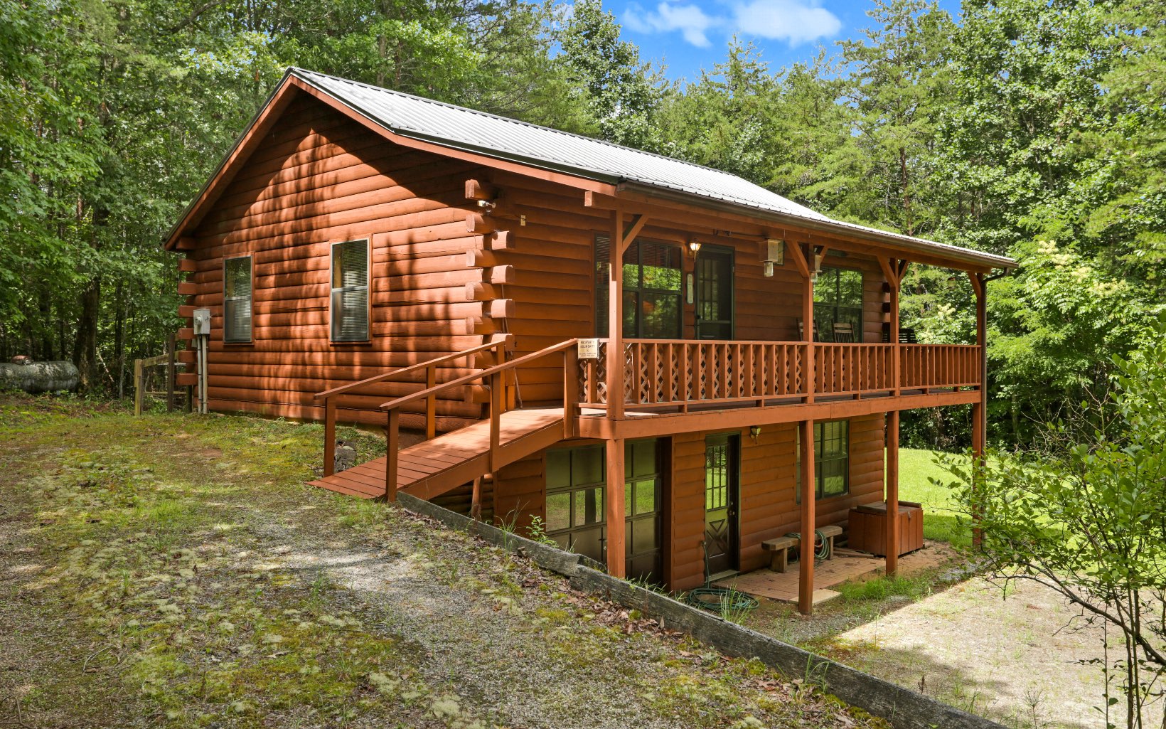 ENJOY THE MOUNTAINS OF NORTH GEORGIA!! Great Cabin in the North Georgia Mountains! Located in a well-established subdivision, this 2 Bedrooms/2 Bathrooms cabin offers Kitchen, Dining & Den area with a stone gas fireplace, a large covered Porch to enjoy the Mountain Views & Air, and one car garage.