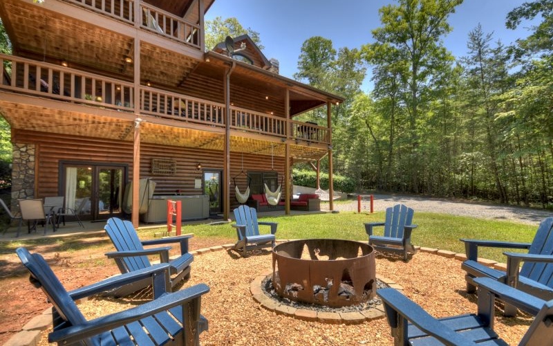 Immaculate, upscale cabin in the heart of My Mountain. Easy drive to downtown Blue Ridge or Blairsville. Live the cabin life, use it as a vacation home, or add it to your investment portfolio. This home can do it all. Movie and Game Room in the basement. Hot Tub on the back patio. Large fire pit. Tons of outdoor seating for entertaining. Massive porches. Huge master bedroom. Loft area for additional sleeping or home office. Fully finished basement.