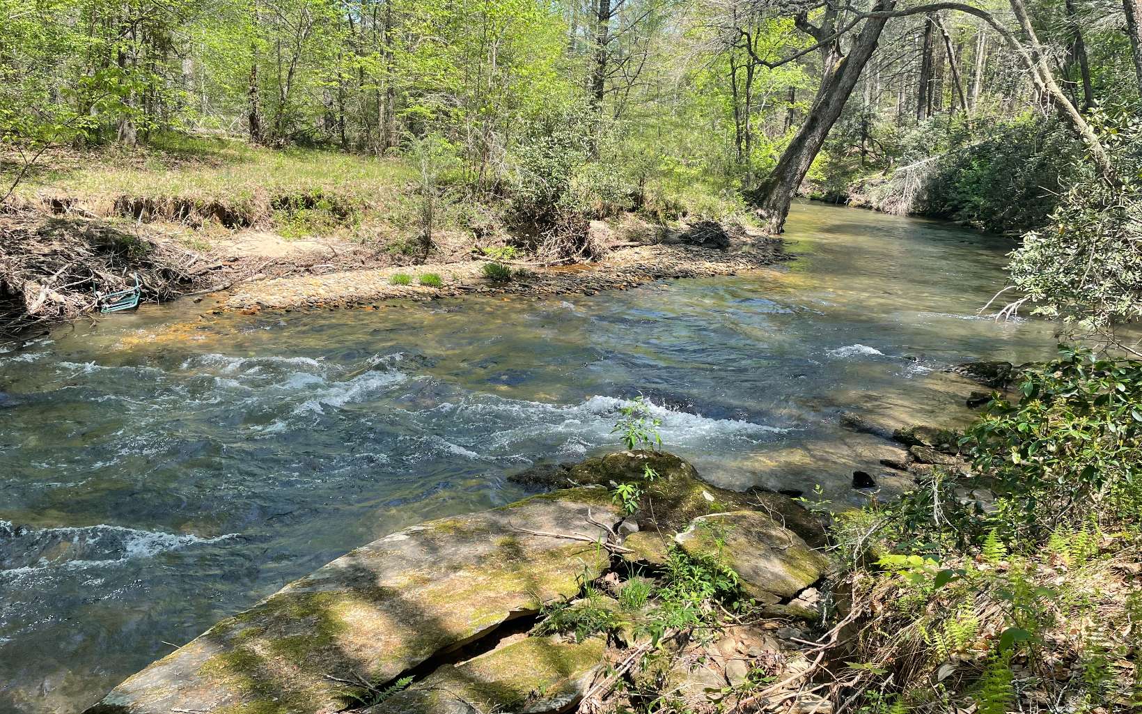 Rapids and white water along the stretch of frontage on Cooper's Creek trout waters! 3 Acres with long frontage on Cooper's Creek and amazing views! Underground utilities including community water system. Driveway to homesite roughed in but needs TLC. Located in the community of The Retreat At Cooper's Creek. Restricted, non-rental neighborhood. Come and spend your days listening to the sweet sounds of rippling waters and enjoy fly fishing!