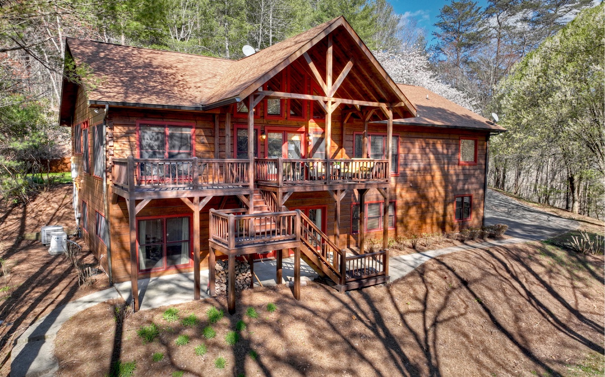 This home checks off EVERYTHING on your list! Extraordinary Builder's True Log Home with LAKE frontage & CREEK frontage, plus a seasonal MOUNTAIN VIEW! Perfectly situated on 3.57 acres, no restrictions, overlooking a 12 acre private lake w/dock. 4500 sq ft of living space featuring, 4BR/3.5BA on main, 2BR/1BA on lower level, 2 laundry, 2 living areas with wood burning masonry fireplaces, expansive kitchen has island w/6 burner cooktop, commercial refrigerator, cabinets galore & dining area. Finished basement, 2 car garage, workshop area, generator, well maintained (septic pumped, termite bond, roof 2011, a/c 2015, furnace 2022, deep well provides delicious water, buried 1000 gallon propane tank, vista pruning, pressure washed/stained, 2 hot water htrs, fiber internet coming soon, new survey, new retaining wall & more!) Some furnishings included; other items negotiable.