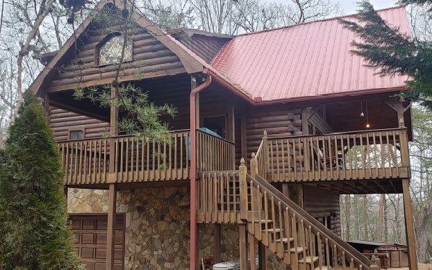 This spacious 3/3 true log home with two gas fireplaces will make a great rental, vacation, or a full time home. The spacious decks offer enchanting long range views of the North Georgia Mountains. Enjoy the views from the deck of the living and dining areas with abundant window coverage. The one car garage is on a level lot that makes this property easy to access by car. Located at the top of My Mountain Road, come and see this very inviting home today! By appointment only!