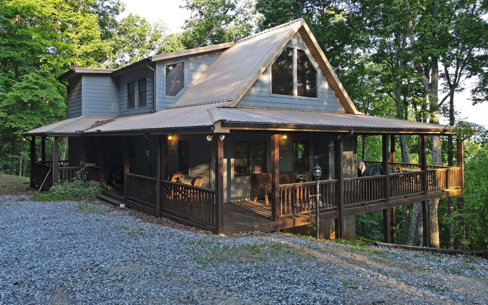 NORTH GA MOUNTAIN CABIN! ACTIVE RENTAL! This quality built 3 bedroom/3 bathroom cabin offers an open floor plan, a private setting, mountain views, a great room with vaulted ceilings, beautiful wood interior, two stacked stone fireplaces, stainless appliances, screened-in balcony off of the master bedroom, jetted tub & shower in the master bathroom, games/billiards room, tons of storage room, concrete patio on the lower level, low maintenance and wrap-around porch to enjoy the wonderful outdoors. Long-range mountain views that will get even better with a little trimming.