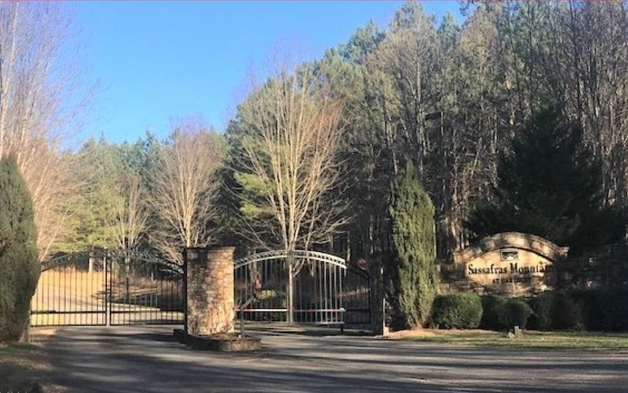 Largest lot available in this upscale Gated Community in the gorgeous Northeast Georgia mountains. Sassafras Mountain has all paved roads in a quiet and peaceful mountain setting. Underground electric, phone and cable. All estate lots are at least 3 acres so there is plenty of privacy. Build your dream home and enjoy all the benefits of mountain life: hiking, trout fishing, wineries and vineyards, biking, apple orchards and much more!