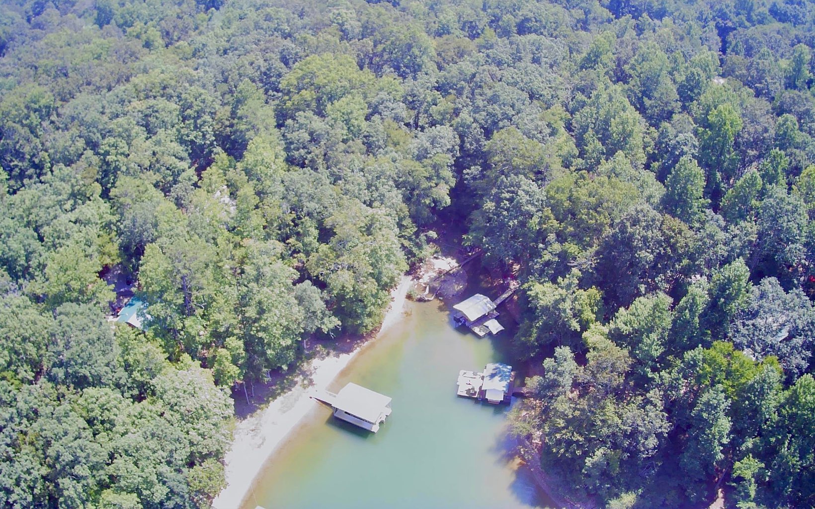 LAKE and CREEK front LOT in the mountains! Build your dream home here on this lot in Blairsville. Lake Nottely is waiting for you. Call today, don't delay!