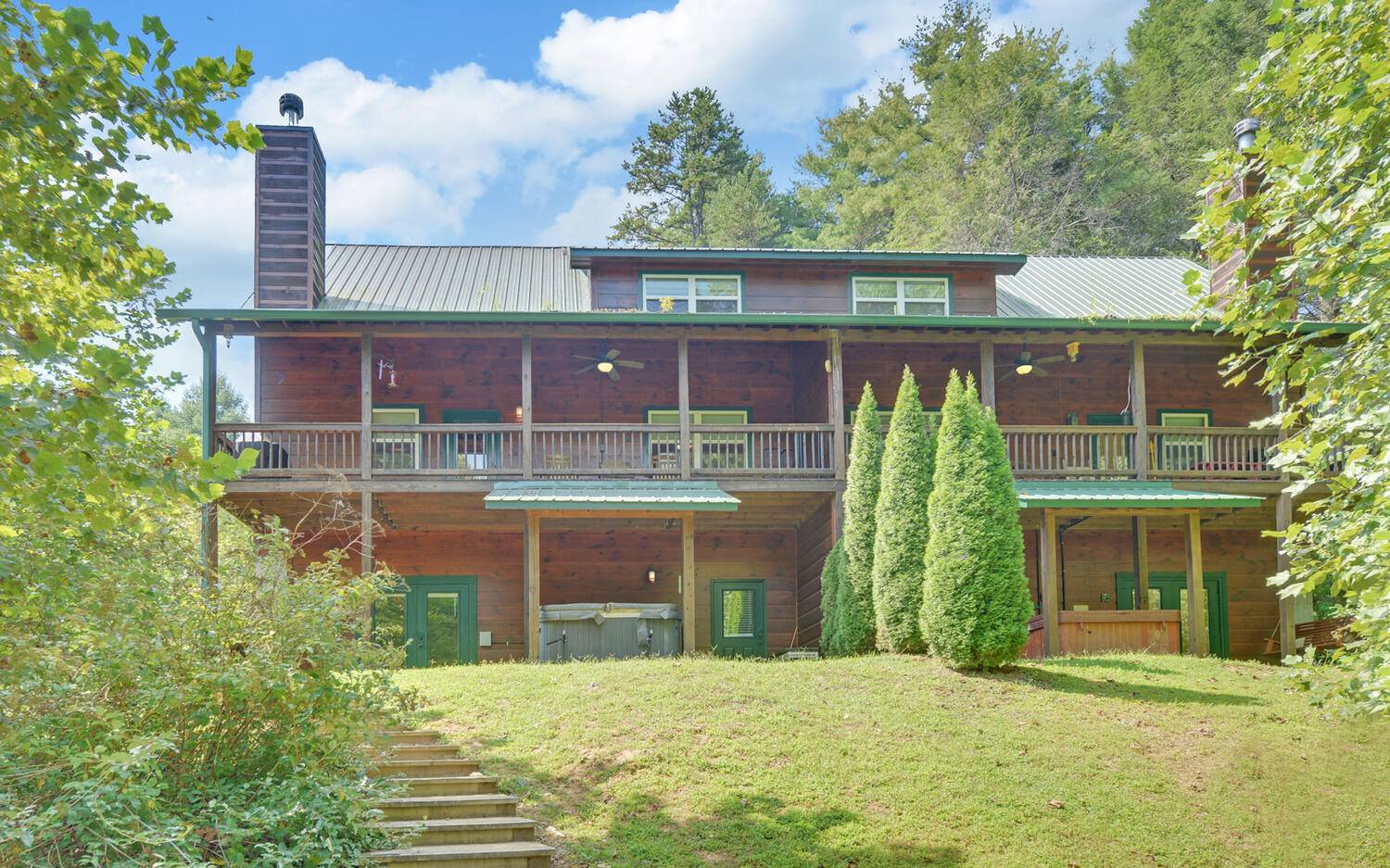 Walk down just a few feet to the Trout Capital of Georgia's famous Toccoa River. Beautiful view of the river, large 3-bedroom home with 3 full baths, fully equipped with everything you see in the cabin. 11 beautiful acres of common grounds. Beautiful rock real wood fireplace, The $300. monthly maintenance fee covers water, sewer, exterior building maintenance, structural insurance for fire, storm damage. Also covers monthly grounds maintenance, pest control termite protection. Everything on the exterior of this building is covered through the HOA maintenance fee. No rental restrictions from the HOA.