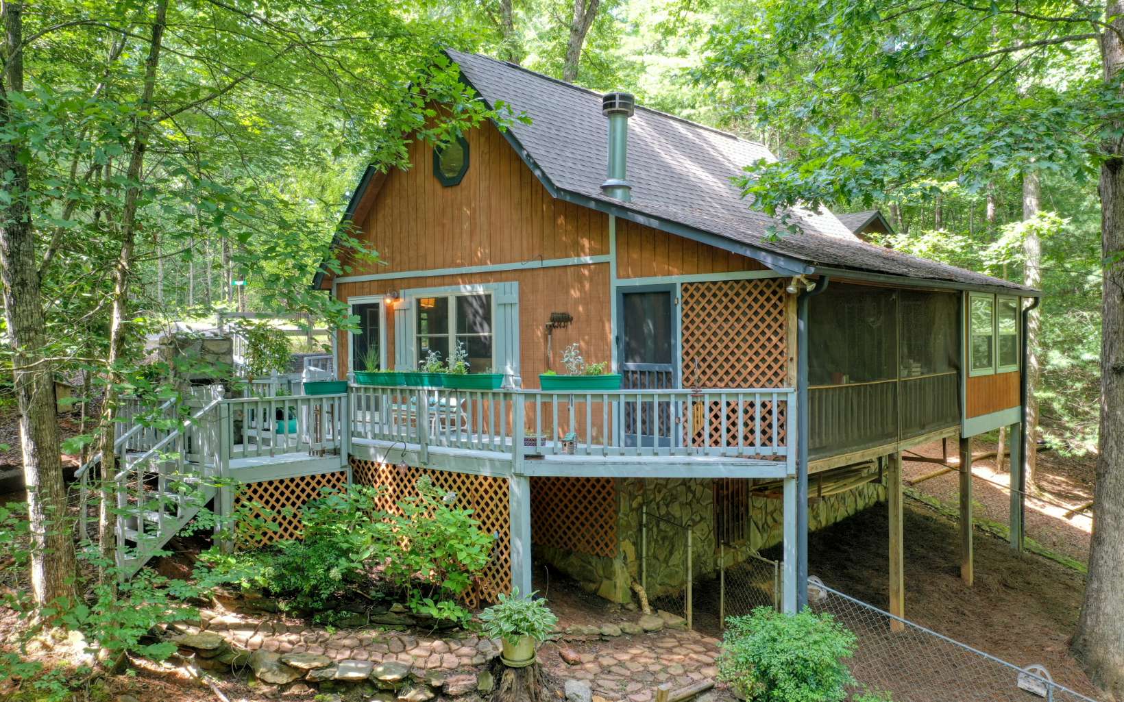 Darlin little cabin nestled in the woods w/ privacy! next to last cabin on rd. 2/1 w/loft being other bedroom. outdoor fireplace/grill area. Extended Master Bedroom main level (2013). Screened porch. Perfect investment rental. Within 15 minutes of Toccoa River for trout fishing & tubing; Lake Blue Ridge for boating & downtown Downtown Blue Ridge for dining & shopping!!! All at an affordable price for getaway cabin or STR investment!!! (County Roads, Private well; New shingles 2019; New vinyl windows 2014; Bathroom remodel 2020; recently painted porches,etc. (GPS WILL NOT GET YOU TO THIS PROPERTY)