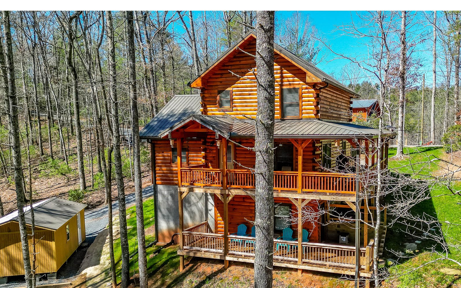 Stunning setting, true log home, and near the wilderness, this is what you've been looking for in a north GA mountain getaway! Only 2 years old, this new custom built cabin offers nearly 3 acres of gorgeous landscape and over 200 feet of frontage on Harpers Creek. Enjoy lots of level terrain for playing near the stream, sitting by the fire pit, and more. This cabin features a metal roof, level front entrance, master on the main, large wood beams, tons of character, 2 fireplaces, 2 bedrooms upstairs with a jack and Jill bathroom and loft, finished basement with an additional hang out living room, bedroom and bathroom. There are two levels of decks overlooking the property making it a perfect place to sip your coffee or cook on the smoker (being left with the house). This property is being offered furnished with amish made hickory and black walnut pieces, luxury cabin decor, an additional storage garage, and generator. There will be no doubt, when you see this property, that it has been loved.