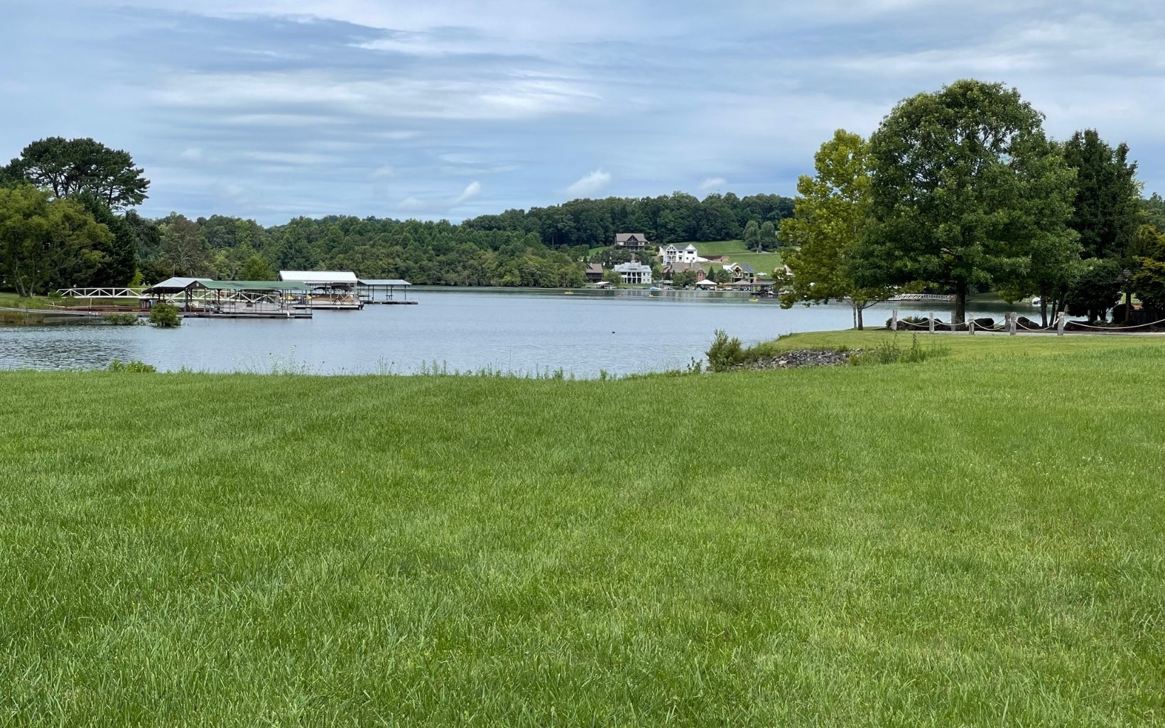 Lakefront Lot in Bell Creek Cove Subdivision, Deeded Boat slip at community Dock. Common area includes boat ramp, Covered Fireplace area with tables, this lot is gentle and easy to build on, close to community dock, one lot away. Easy drive to Hiawassee and located on a beautiful part of Lake Chatuge.