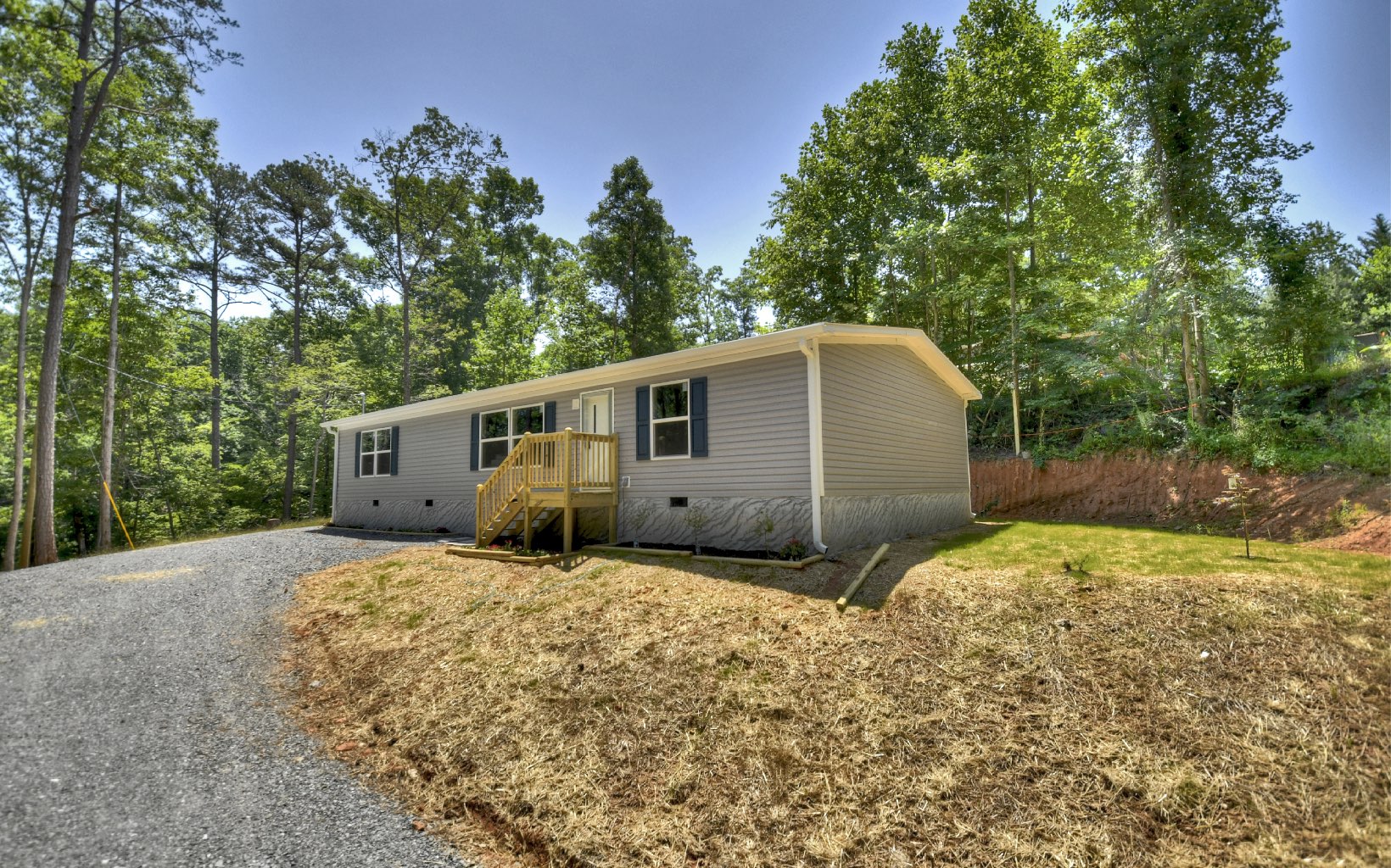 BACK ON THE MARKET^^^Under Construction with Permanent foundation available for FHA & VA Financing!! Are you Renting, now is the time to Buy!! Brand New Manufactured Home Features 3 Bedrooms 2 Full Baths Open Concept Floor Plan!! Just minutes from Hwy 515, Ellijay & Carter's Lake!! On 1.25 Acres County Water available!! HOA fee $250.00!! ^^^Under Construction Photos are representative and are subject to change.