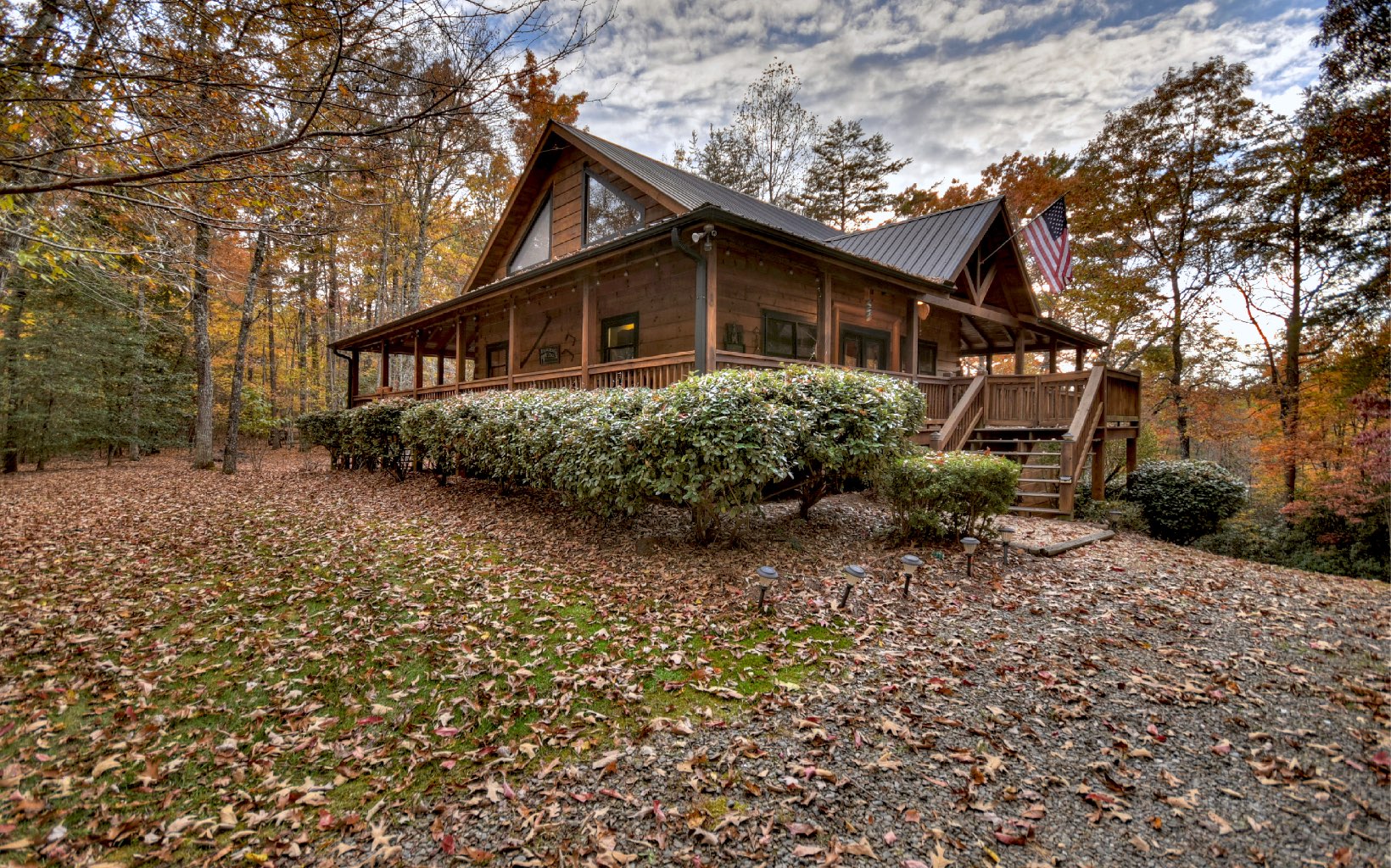 Unique Mountain Cottage nestled in a very desirable River Estates community near Downtown Blue Ridge, this 3br/3.5ba cabin offers privacy & an abundance of wildlife views complete with Toccoa River Access. A rarity for the area. From the front, the home invites you in with its elegant wrap around porch & subtle woodwork details. This true log cabin offers warm finishes that define the inviting & friendly feel. Upon entry you will find the pleasant & comfortable living space complimented by a floor to ceiling stone fireplace & wood beam cathedral ceilings. This well-designed property offers a functional floor plan & convenient main level living area, a spacious Primary en suite on main level, upscale wood interior design, & an oversize loft area that can sleep up to 6. The full finished basement level comes complete w laundry area & addtl entertainment space. Not to be outdone, the walk-out lower level enjoys an appealing covered patio w possible fire pit area, access to the large, manicured backyard & storage shed for tools. Perfectly placed to enjoy all that Blue Ridge has to offer w low maintenance living & a world of recreation right out the door. Blue Ridge offers the finest in culture, shopping & dining. It is a mecca for year-round recreational activities & offers endless opportunities golfing, fishing, hiking, biking, rafting, kayaking & more. Enjoy its endless beauty throughout the seasons!