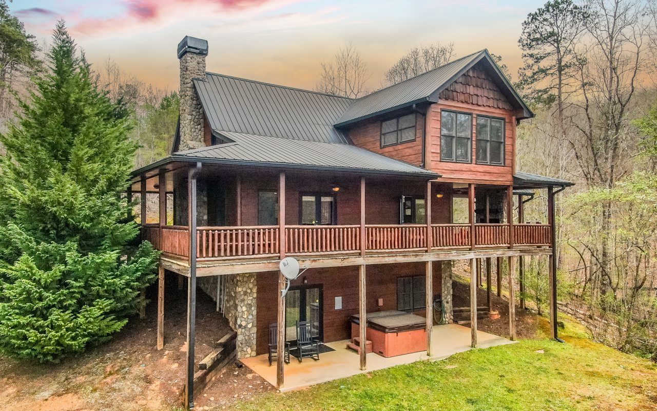 TURN KEY!! The Perfect Blend of Rustic & Modern! This Income Producer, sports a Wrap Around Covered Porch with Outside Fireplace, Fantastic Mountain View, HUGE MASTER SUITE, with Gentle Access just to get started!