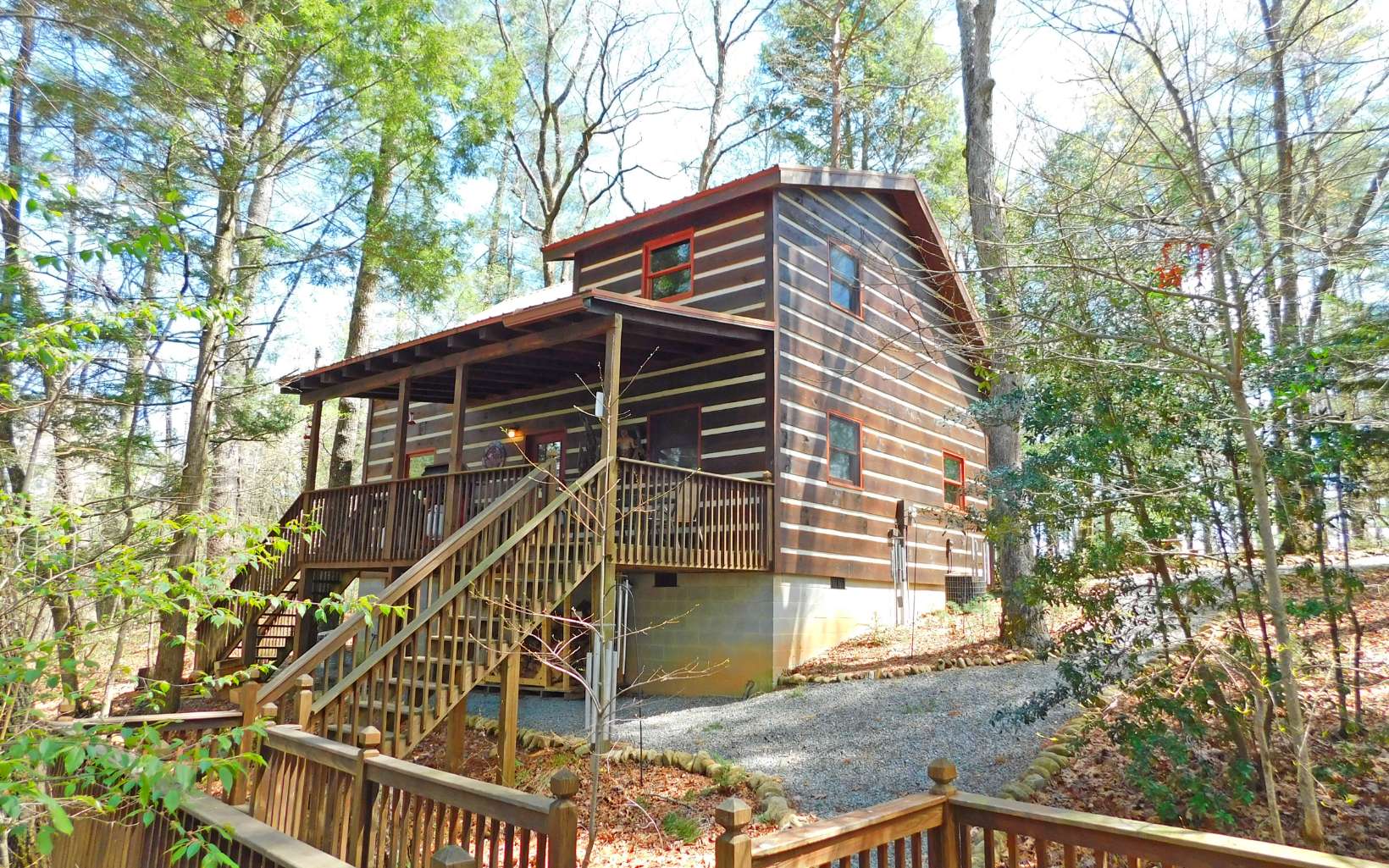 Truly A Cabin in the Woods! This traditional 2/2 cabin is tucked away in beautiful Blue Ridge Ga. With a healthy rental history that can be expanded it will be the perfect investment property. Furniture included for a Turn Key Cabin.