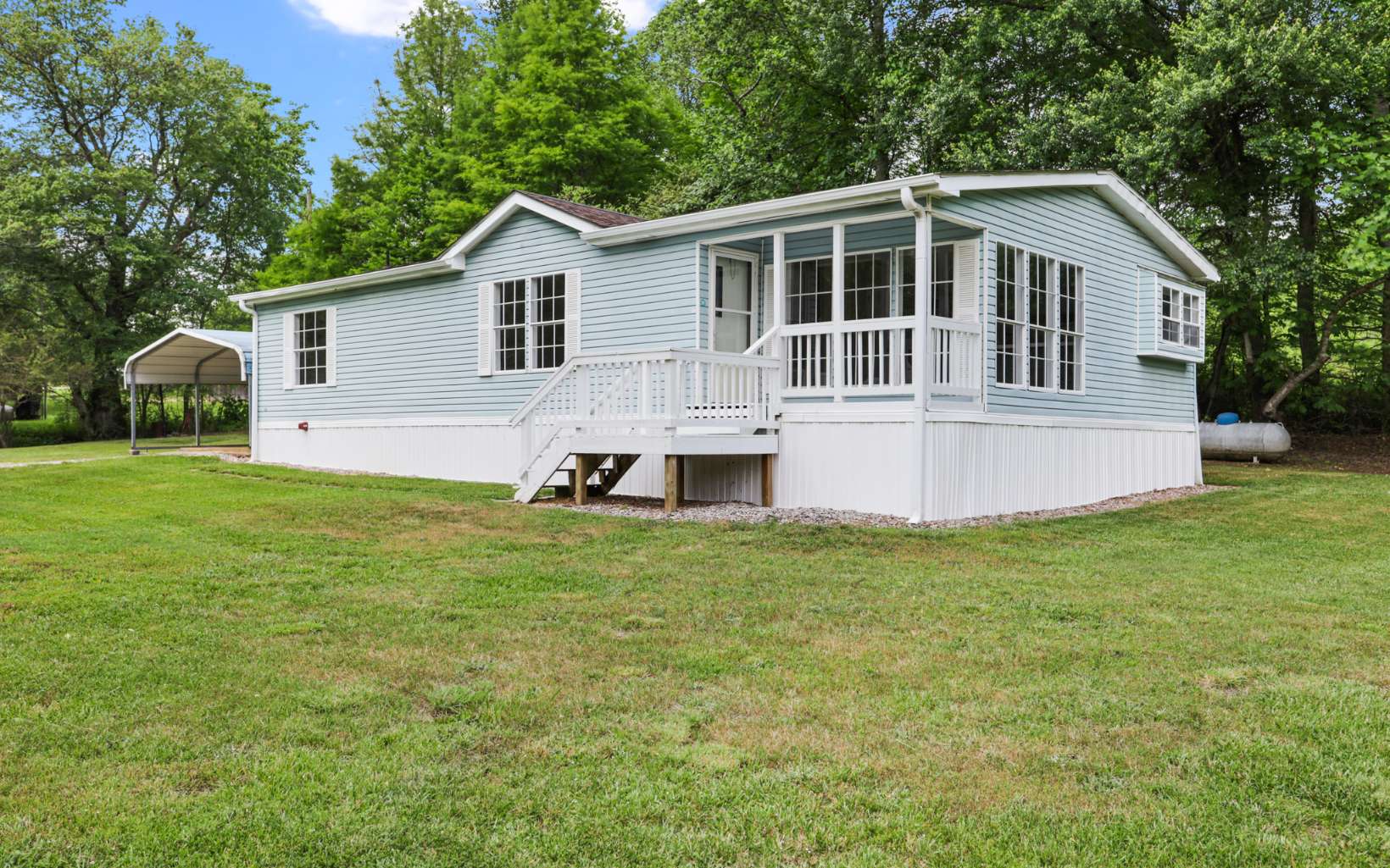 What a location! Just minutes from downtown Blairsville, This 3/2 double wide is sitting in one of north Georgia's most highly desirable areas. It has a picturesque setting with a beautiful garden area and branch running along the front of the property. This is a great low maintenance property, and is a VERY affordable investment for most budgets!